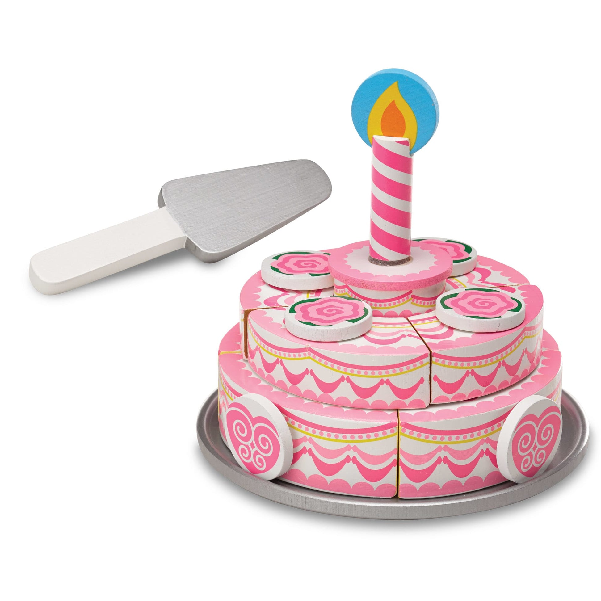 Pink toy birthday cake with a candle and spatula on a white background