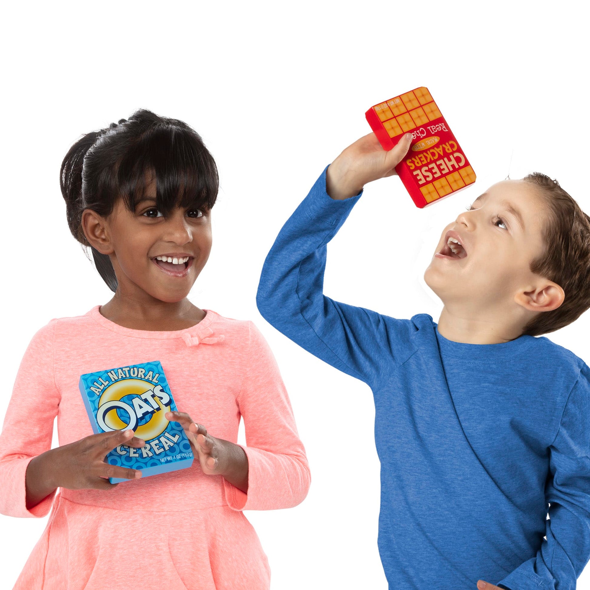 Two children holding colorful cereal boxes against a white background