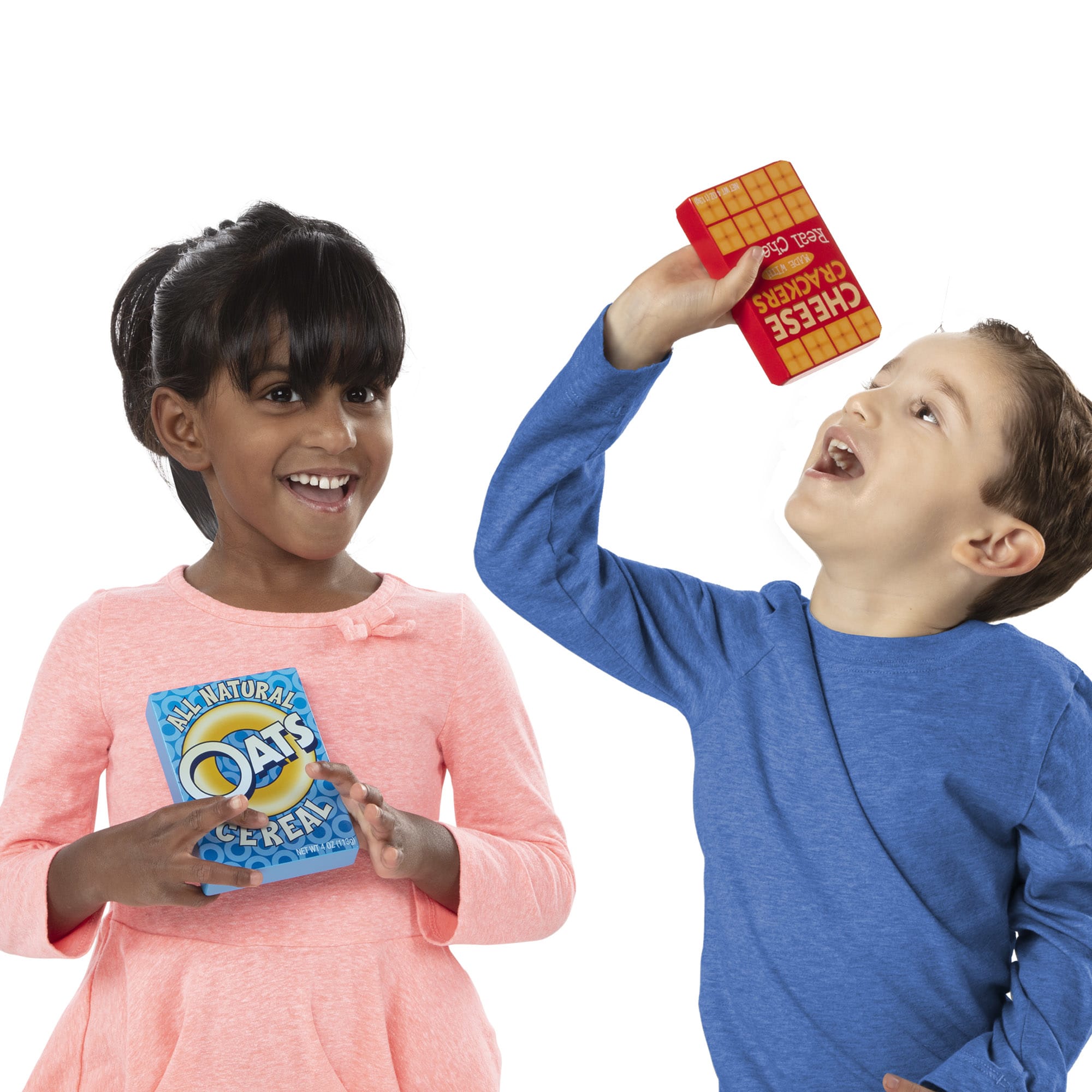 Two children holding colorful cereal boxes against a white background