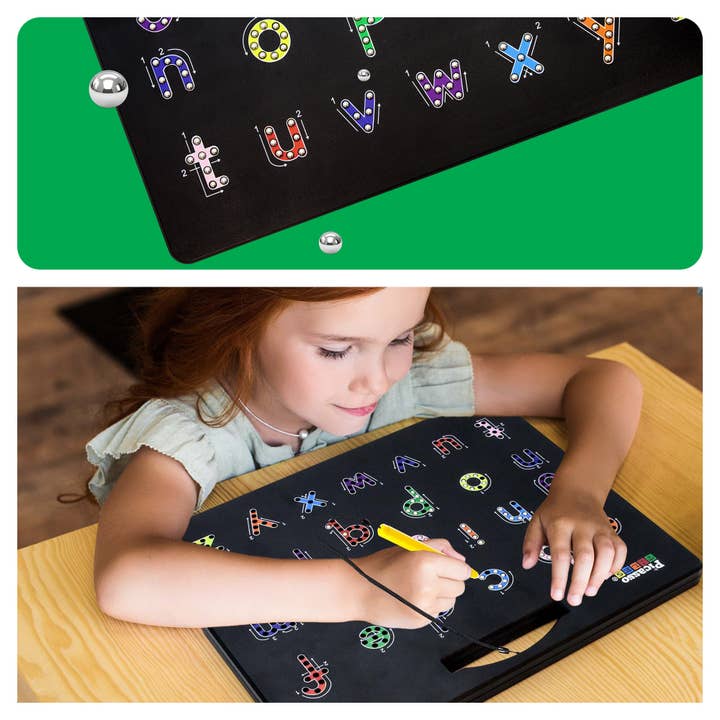 Child using a magnetic pen  with letters on a wooden table