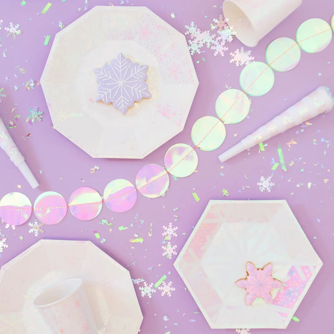 Hexagonal plate with white snowflake design on a pink and purple gradient background
