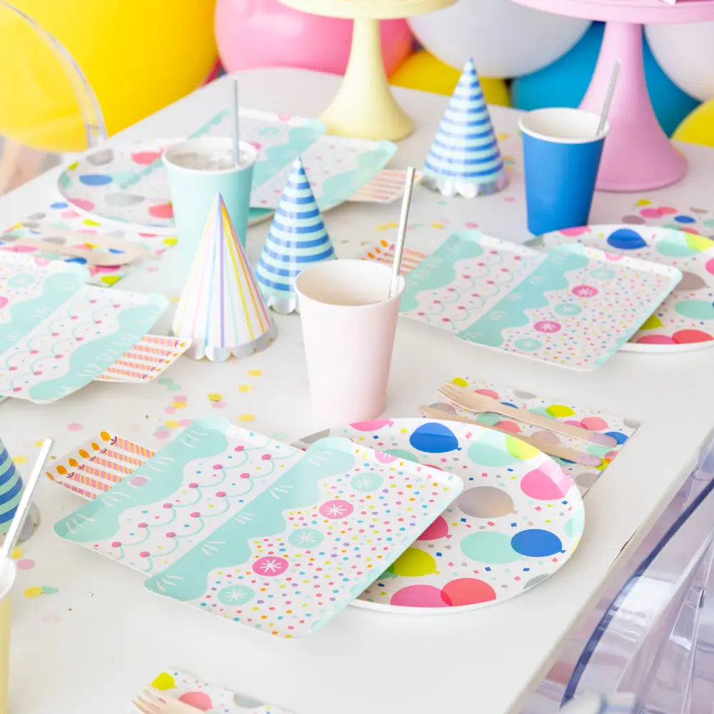 Round paper plate with colorful balloon pattern on a white background