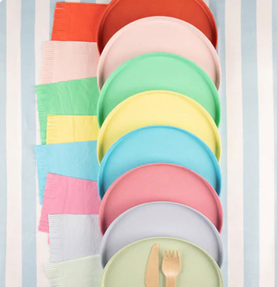 Set of colorful plates and napkins stacked vertically against a light blue background